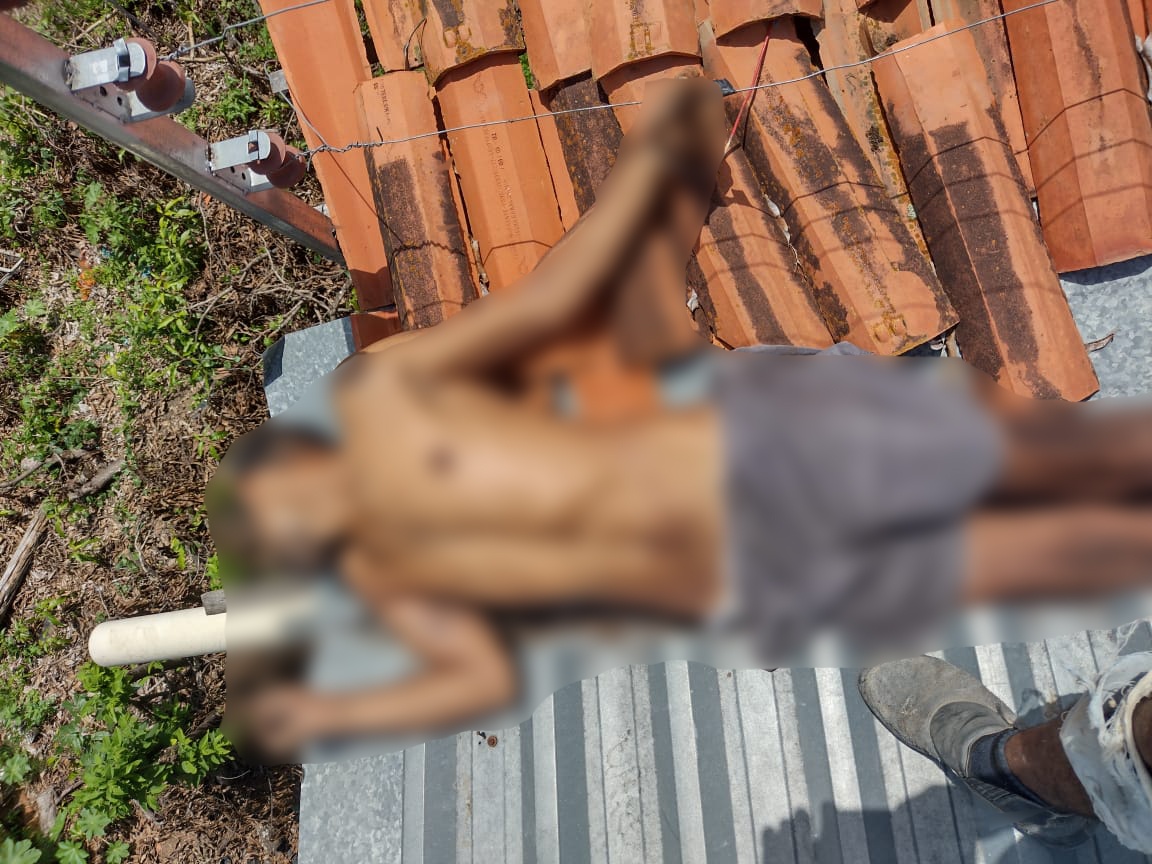 Homem morto em cerca