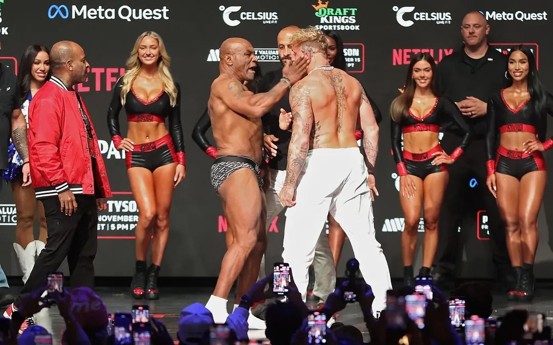 Jake Paul provoca Mike Tyson e é agredido durante pesagem.