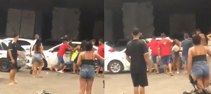 Grupo de pessoas agredindo o policial