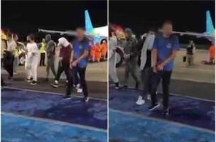 Imagens dos brasileiros algemados circularam na internet e causaram reações (Foto: Reprodução)