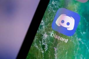 21 June 2019, Baden-Wuerttemberg, Stuttgart: The Discord app is displayed on the screen of an iPhone. Photo: Fabian Sommer/dpa (Photo by Fabian Sommer/picture alliance via Getty Images) (Fabian Sommer/Getty Images) (Foto: Divulgação)